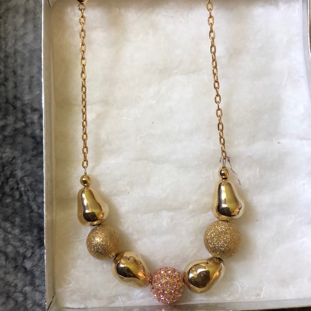20inch gold colored necklace with pink pendant